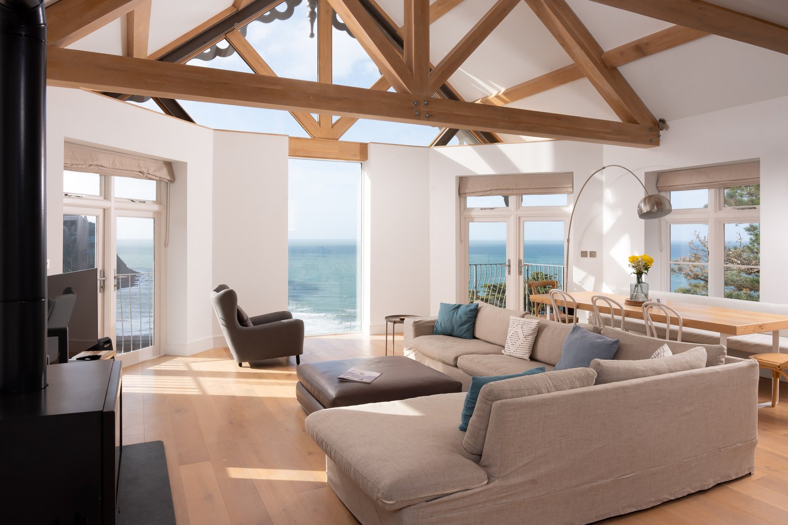 Tors Park apartment interior with exposed timber trusses and sea view, Lynmouth